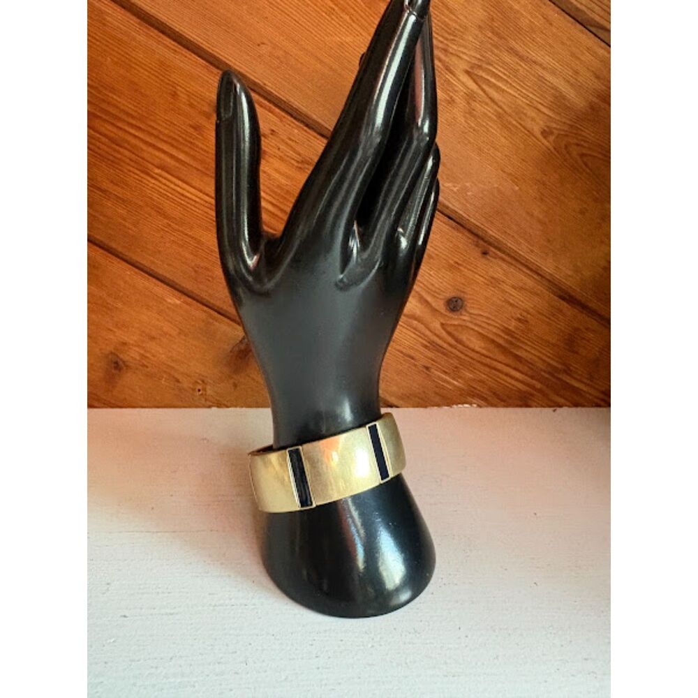 Gold stretch bracelet featuring a bold black accent